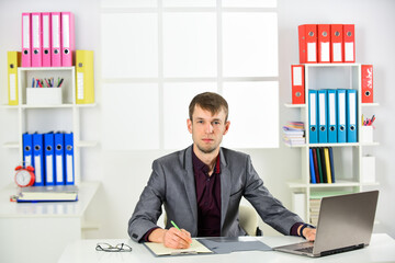 Man with laptop computer work in office, online business concept