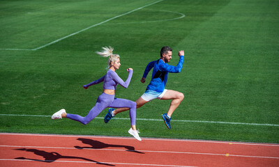 Sport. marathon speed. sport couple run fast to win. successful fitness sprinters. athletic man and...