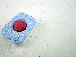 Dishwasher detergent tablet on white background