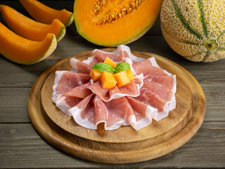 Prosciutto ham and melon. Traditional Italian food. Raw ham.