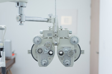 instrument of an ophthalmologist, or eye doctor, instrument for eye exams in office with white walls