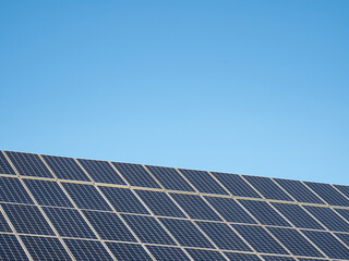 Fototapeta premium solar panel against blue sky in sunshine