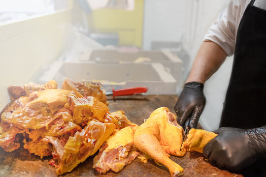 Butcher Prep Cuts Chicken On Wooden Cutting Board. Fresh And Healthy Food Preparation Concept