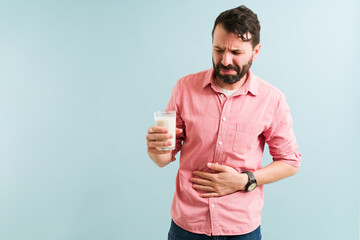 Adult man feeling bloated and with indigestion