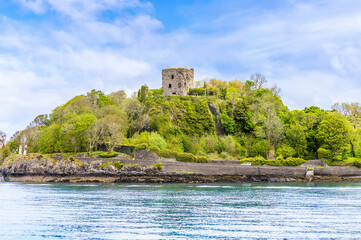 Fototapeta na wymiar A view from the Firth of Lorn towards Dunollie Castle at Oban, Scotland on a summers day