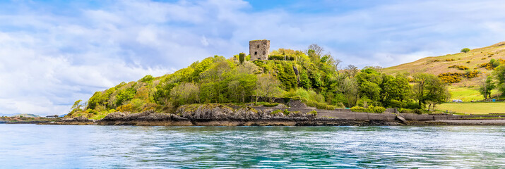 A panorama view from the Firth of Lorn towards Dunollie Castle at Oban, Scotland on a summers day