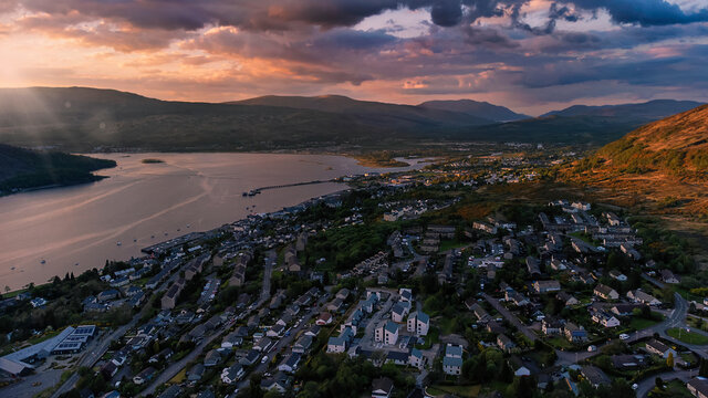 Drone image of sunset over Fort William and Loch Linnhe in the Scottish Highlands, UK