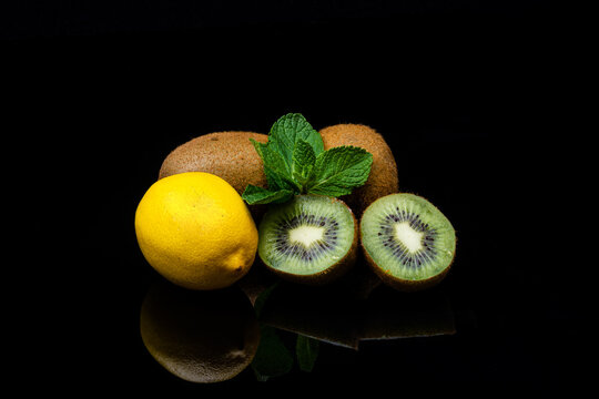 Lemon mint and kiwi. Vitamin C in fruits, on a black background.