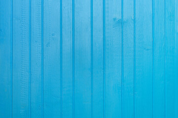 Blue painted colored wooden plank background close up