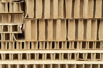 cut of honeycomb cardboard pack stack with large cells close-up as a background