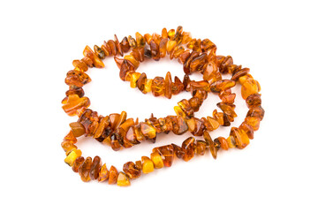 Baltic necklace made of Natural polished transparent honey luxury amber beads with inclusions on white. close up selective soft focus. Space for text