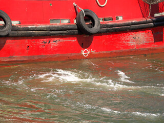 The ship turns around and a water funnel has formed.