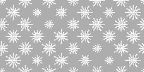 Winter seamless pattern with white snowflakes on grey background. Vector illustration for fabric, textile wallpaper, posters, gift wrapping paper. Christmas vector illustration. Falling snow