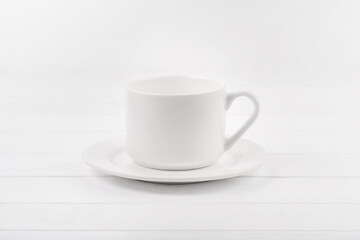 Empty white ceramic plate and cup