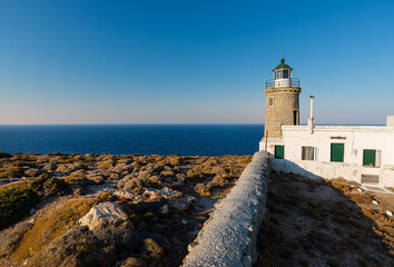 Fototapeta na wymiar Lighthouse Gria on the north coast of the Greek island of Andros in the Cyclades archipelago