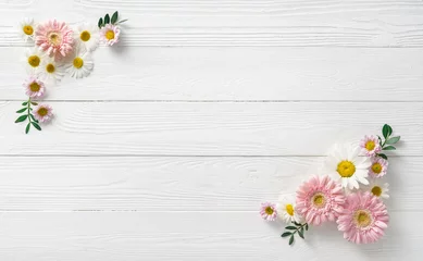 Fotobehang Flowers composition. White flowers on white wooden background. Wedding mockup with pink and white flowers. Flat lay, top view, frame. Gerbera, chamomile flowers. © Tatyana Sidyukova