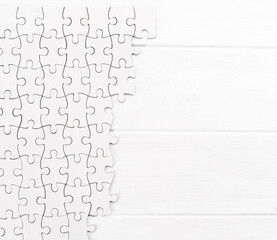 Matching pieces of empty puzzle on white background
