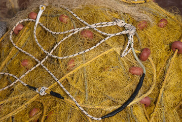 Astros Port, Peloponnese, Greece - June 24, 2021: Fishing nets drying at a picturesque fishing port.