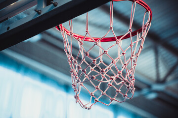 Red Basketball Rim with net. Basketball hoop in a sports complex. Sport concept