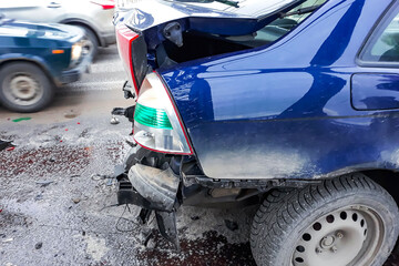 Accident on the road. Damaged cars after the collision. Fragment of a broken bumper.