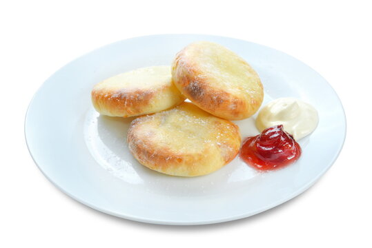cottage cheese pancake with jam on whipe plate isolated on white