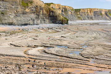 Aerial view of dramatic limestone cliffs and coastline at Southerndown, Wales