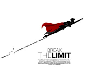 Silhouette of businessman flying to break the chain at foot. Concept of break the rule and limit in business.