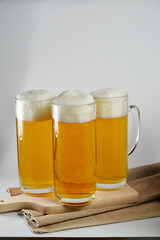 two Glasses of light beer with decorations and place for text