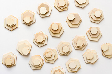 piles of hexagonal shapes on white
