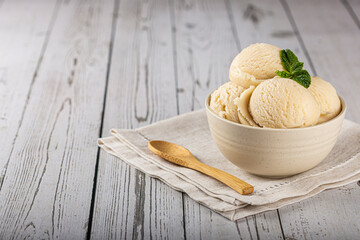 Bowl with vanilla ice cream balls.