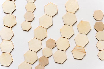 background made of hexagonal wooden shapes on white