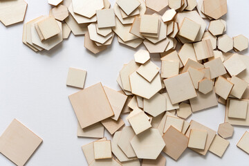 piles of wooden shapes on white