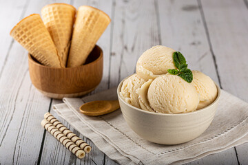 Bowl with vanilla ice cream balls.