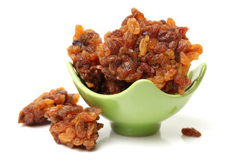 brown raisins on a white background