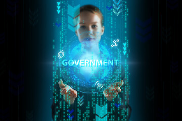 Business, Technology, Internet and network concept. Young businessman working on a virtual screen of the future and sees the inscription: Government