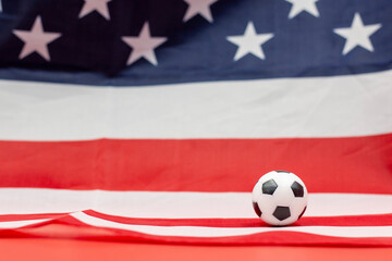 Fototapeta premium Soccer ball with flag of America background