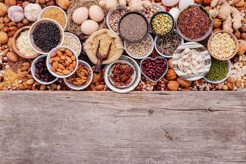 Ingredients for the healthy foods selection in ceramic bowl. The concept of superfoods set up on white shabby wooden background with copy space.