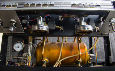 Inside the coffee machine .Repairing of broken coffee machine