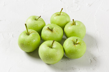 Ripe green apples on table