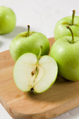 Ripe green apples on table