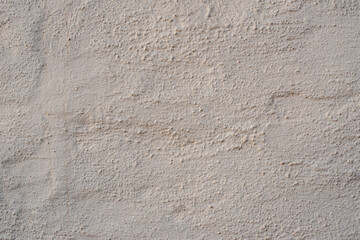 pared de cemento con un color pintado ladrillo, mostaza de fondo texturizado con lineas festuchado aspero.