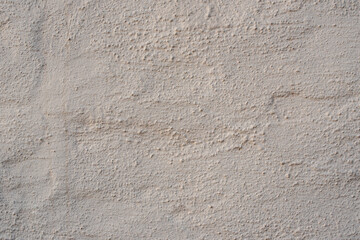 pared de cemento con un color pintado ladrillo, mostaza de fondo texturizado con lineas festuchado...