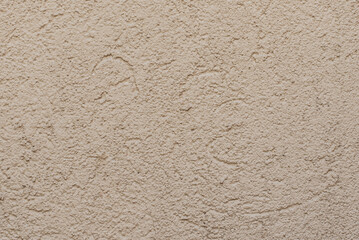 pared de cemento con un color pintado ladrillo, mostaza de fondo texturizado con lineas festuchado aspero.