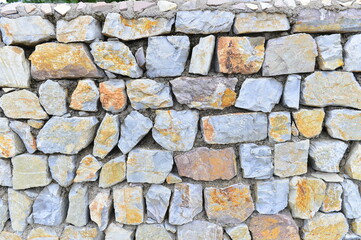 Brick and stone walls, red leaves
