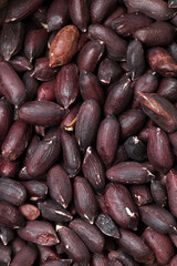 black peanuts on white background