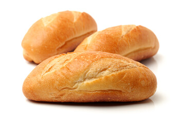 crusty mini baguettes on white surface