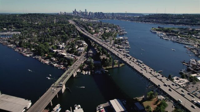 Amazing Aerial of Seattle City with Cars Crossing Bridge and Boats Cruising Lake