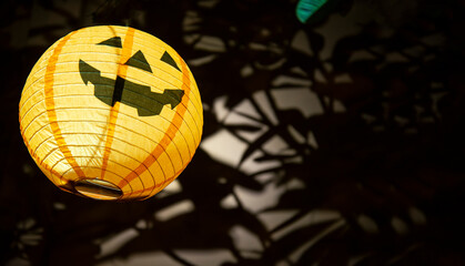 Halloween pumpkin head jack lantern in the garden