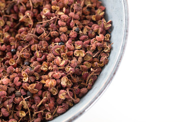 Dried peppercorns in a bowl