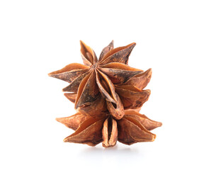 Few grains of star anise on white background